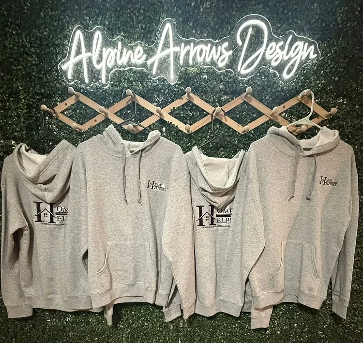 Heather grey hoodies with a DTF-printed general contracting company logo