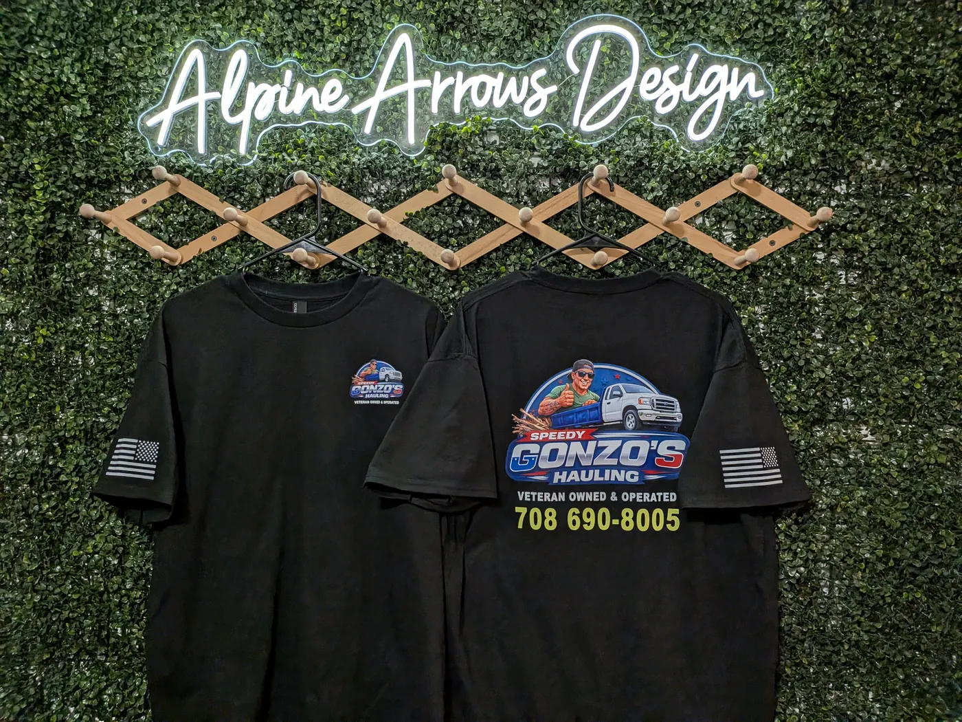 Matching hauling company tees showing a small left-chest print alongside the full-front version