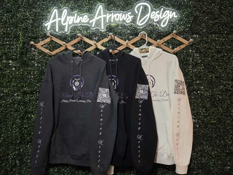 Small business hoodies with a full-color chest logo, a scannable QR code and custom sleeve lettering