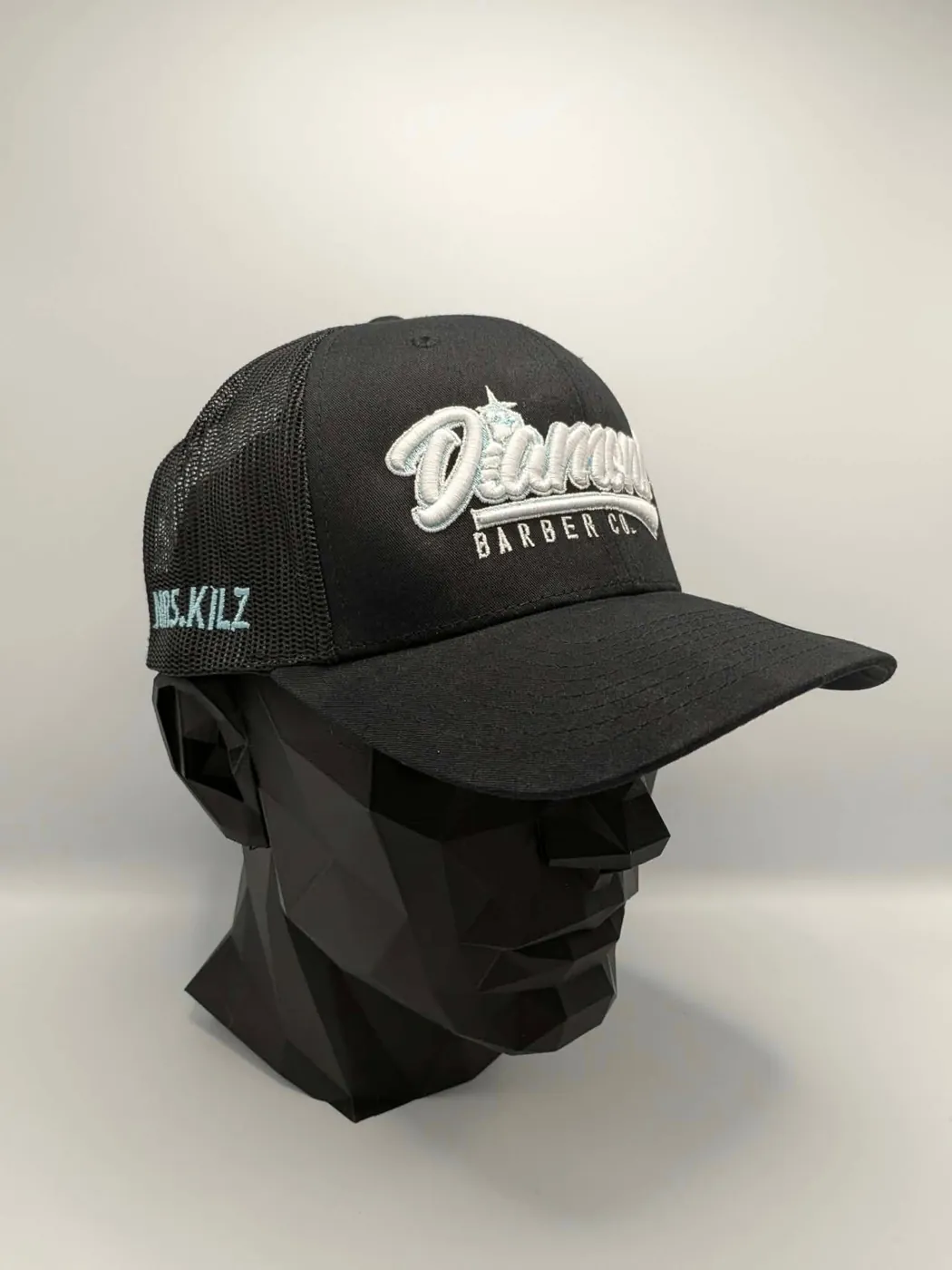 Custom embroidered barber shop trucker cap