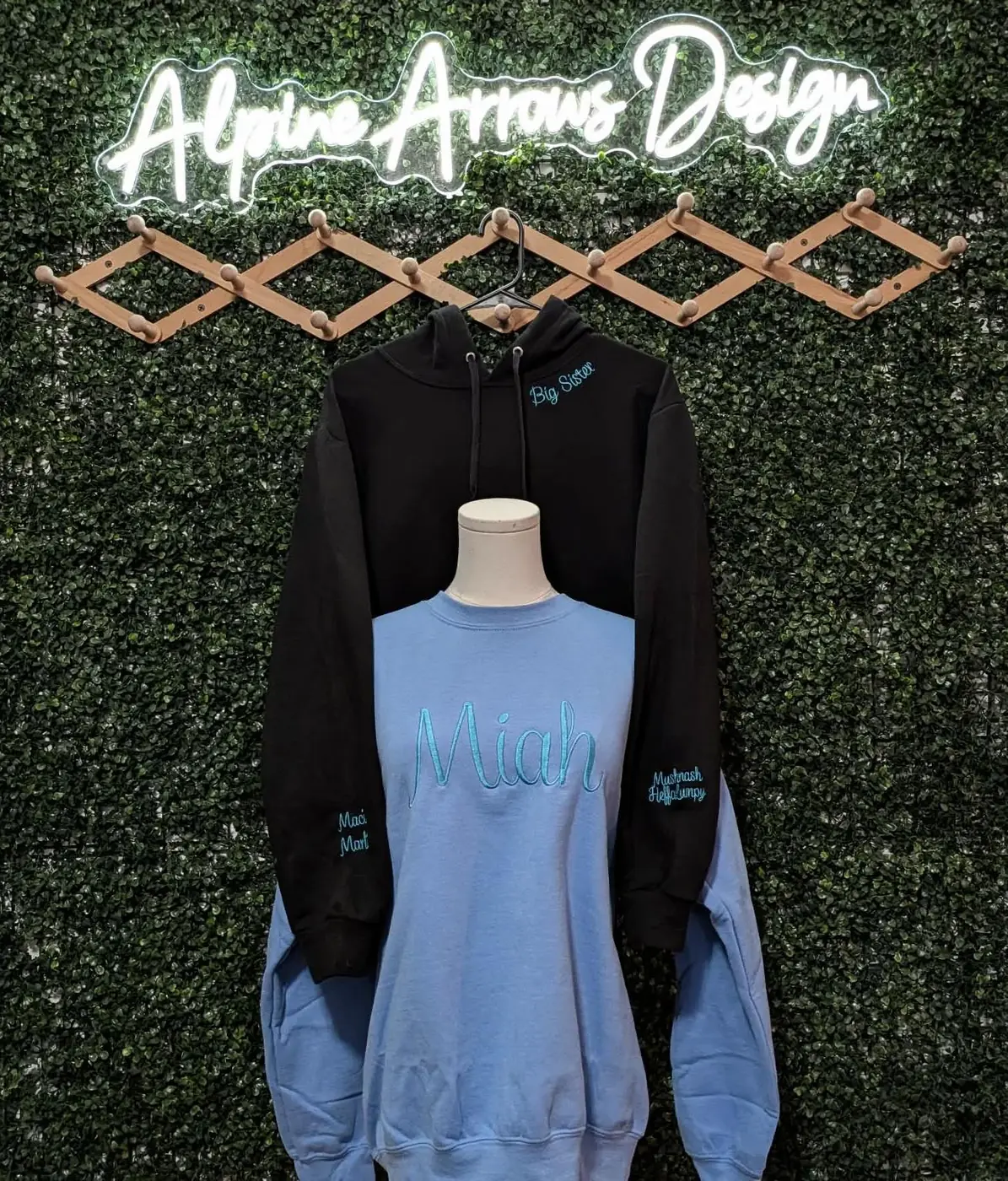 Personalized embroidered name hoodie and crewneck sweatshirt with custom sleeve lettering