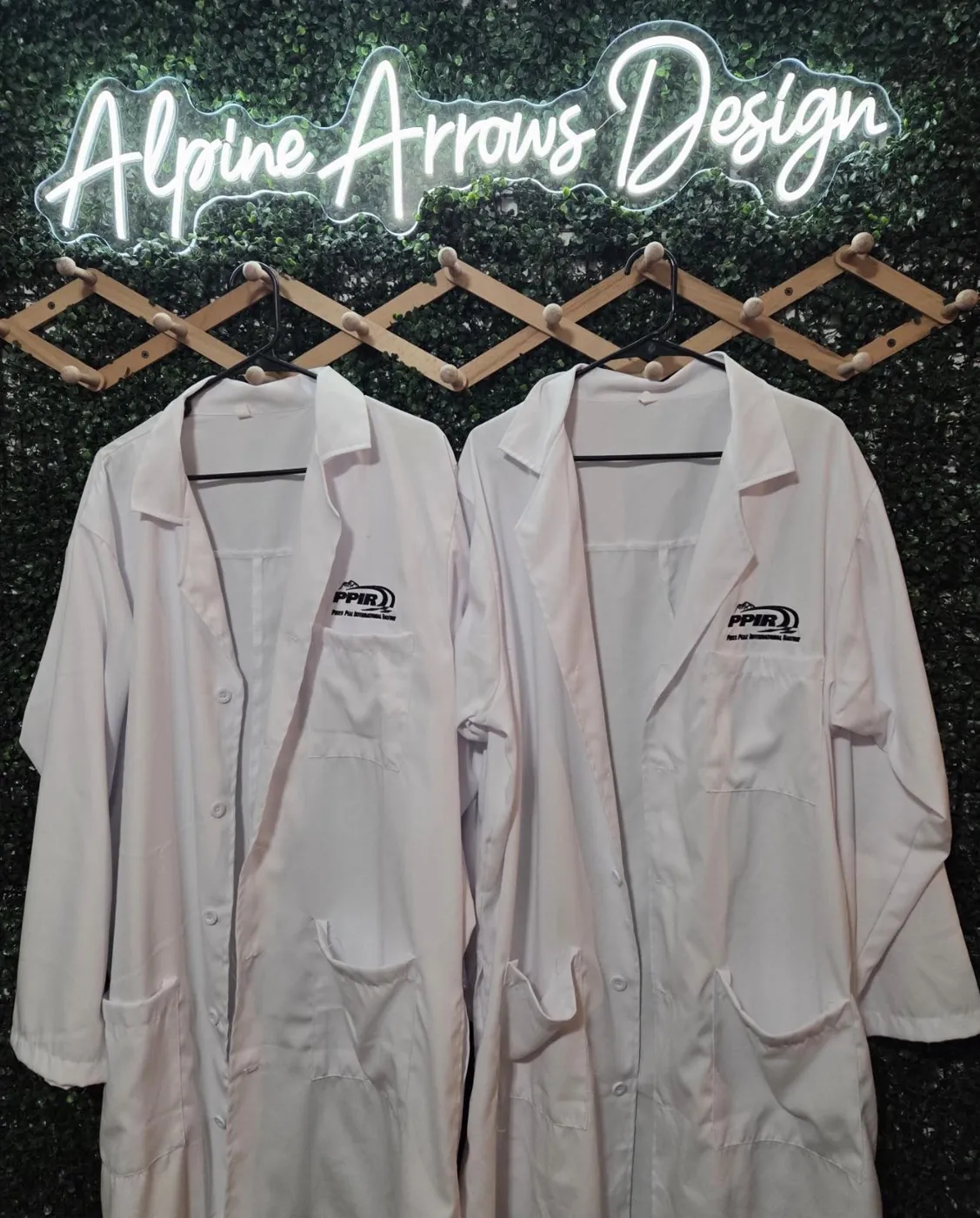 Embroidered lab coats with a raceway logo, custom commercial embroidery
